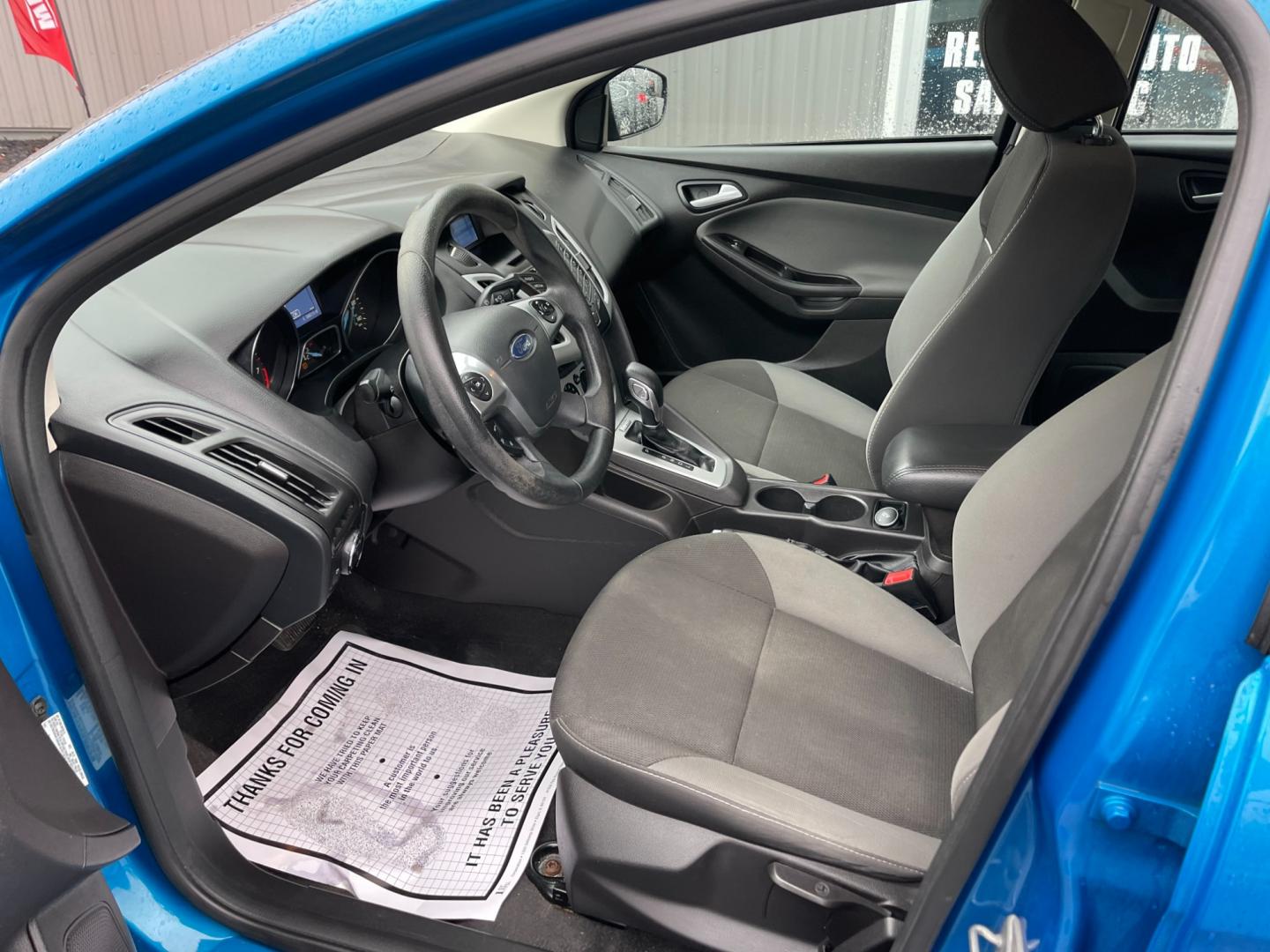 2014 Blue /Black Ford Focus SE Sedan (1FADP3F2XEL) with an 2.0L I4 DOHC 16V FFV engine, 6-Speed Automatic transmission, located at 547 E. Main St., Orwell, OH, 44076, (440) 437-5893, 41.535435, -80.847855 - Photo#17